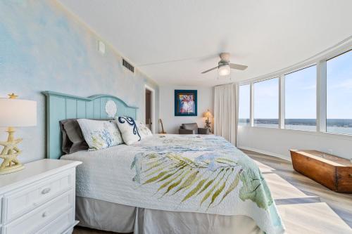 a bedroom with a bed and a large window at On the Beach-2/Br 2/Bath, 26th floor! Spectacular views of Ocean & River in Daytona Beach Shores