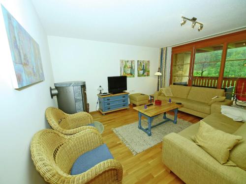 a living room with a couch and a table at Chalet in Brand nahe Skilift & Pisten in Brand