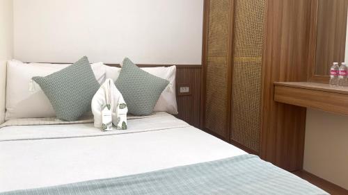 タリサイにあるMMaple Residences Talisayのベッド