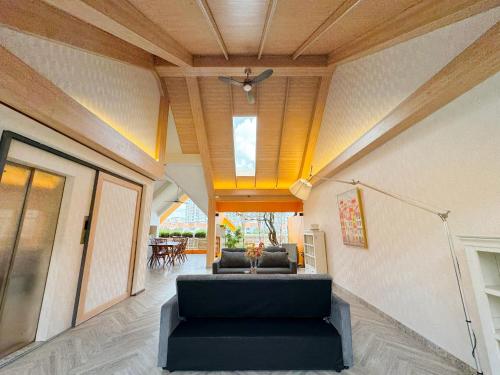 a living room with a couch and a ceiling at Lakeview Park Villas - Every Duplex with Private Pool in Ho Chi Minh City