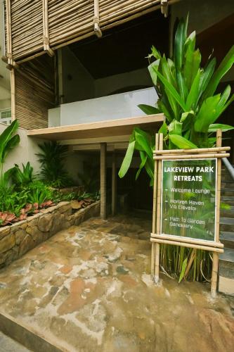 a sign in front of a building with a bench at Lakeview Park Villas - Every Duplex with Private Pool in Ho Chi Minh City