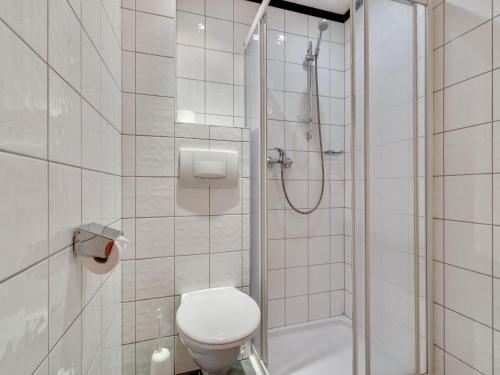 a white bathroom with a shower and a toilet at Apartment in Kappl near Ski Slopes in Kappl