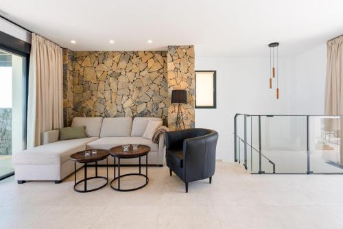 a living room with a couch and a table at MSW07 - 3 bedroom pool and jacuzzi in Torrox Costa