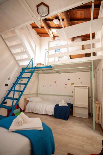 a bedroom with two bunk beds and a staircase at Il Principe di Stifone - Affitti Brevi Italia in Narni