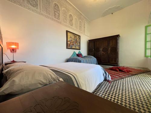 Postel nebo postele na pokoji v ubytování Riad Altura Coliving