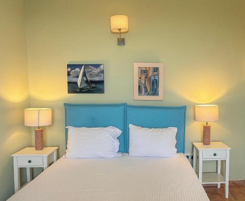 Ένα ή περισσότερα κρεβάτια σε δωμάτιο στο Villa Il Paradiso Andros