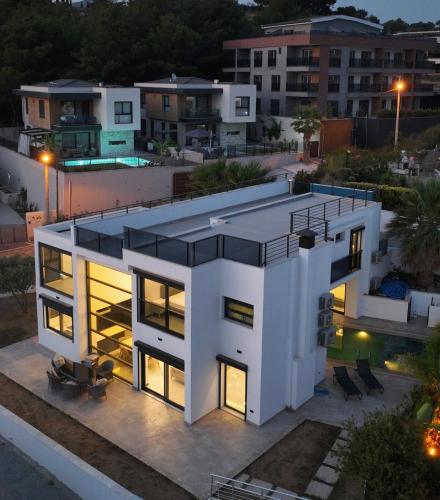an aerial view of a house at night at Luxury villa with private pool in Kusadası