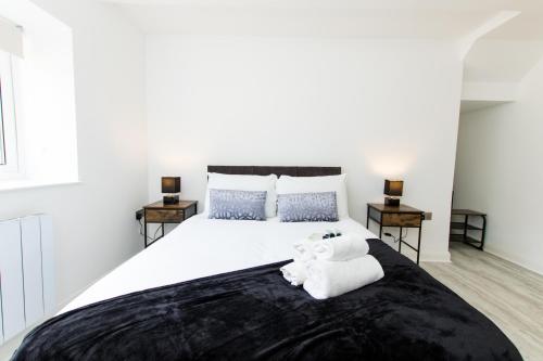 Ένα ή περισσότερα κρεβάτια σε δωμάτιο στο K Suites - Fulbridge Road 110
