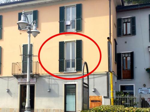 a red circle on the side of a building at Apartment in Ghiffa with Lake Maggiore Views in Ghiffa
