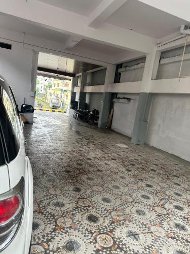 an empty parking garage with a car parked in it at KML Grand Stay in Bhadrāchalam