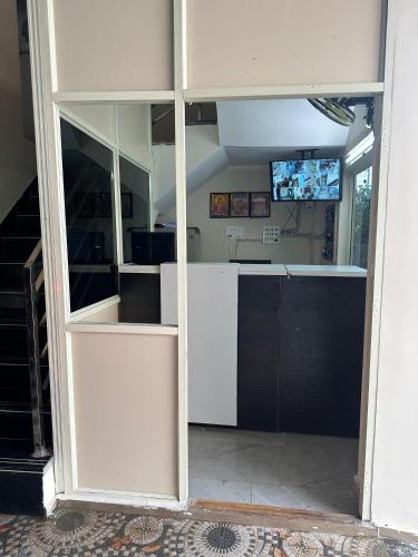an open door to a kitchen in a house at KML Grand Stay in Bhadrāchalam