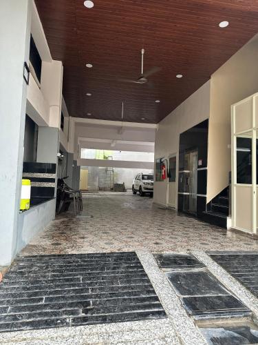 an empty garage with a car parked in it at KML Grand Stay in Bhadrāchalam