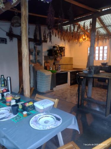 a kitchen with a table with a plate on it at Dormir con llamas in Maimará