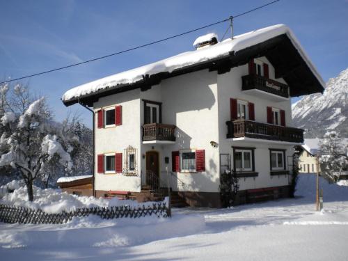 a house with snow on the roof in the snow at Chalet in Ellmau near Skiwelt Slopes in Ellmau