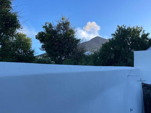 a view from the roof of a house with a mountain at La casa del Geologo in Stromboli