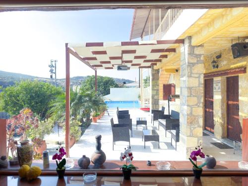 a view of a pool from a house with a patio at Villa Olive Tree with Private Pool in Kissamos