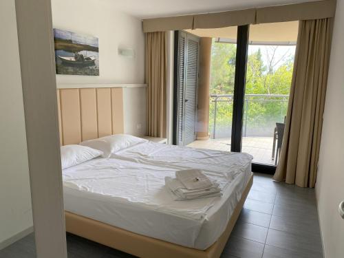 Ένα ή περισσότερα κρεβάτια σε δωμάτιο στο Residence al Bosco
