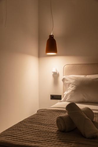 Ένα ή περισσότερα κρεβάτια σε δωμάτιο στο Bona Eterna Timeless Suites