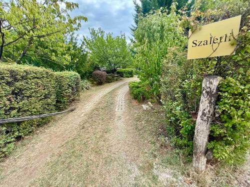 a dirt road with a sign that reads sashaearch at Szaletli in Tihany
