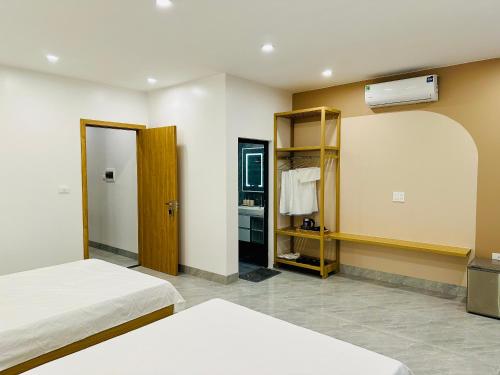Ένα ή περισσότερα κρεβάτια σε δωμάτιο στο Thu Ha Homestay - VTĐ7-61 - Vinhomes Ocean Park 3