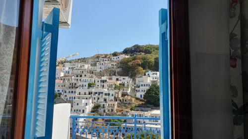 a view from a window of a city at Comfort and unparalleled view in Kóronos