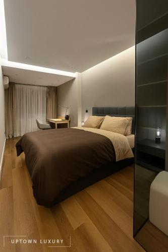 a bedroom with a large bed and a desk at XIII 1d in Lisbon