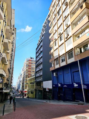 a city street with tall buildings and a building at Apto Inteiro Centro Sta Casa 200m WIFI Perto de Tudo até 4 pessoas in Porto Alegre
