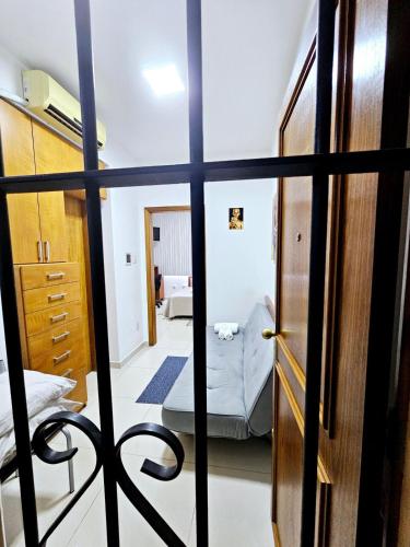 a view of a bedroom through a door at Apto Inteiro Centro Sta Casa 200m WIFI Perto de Tudo até 4 pessoas in Porto Alegre