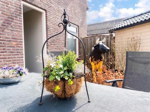 a flower basket on a table in a garden at Peaceful Family Home in Elim in Elim