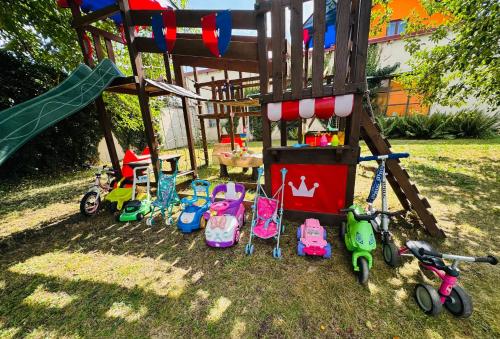 a group of childrens toys in a playground at Rodinný apartmán se saunou, bazénem a hřištěm Staňkov in Staňkov
