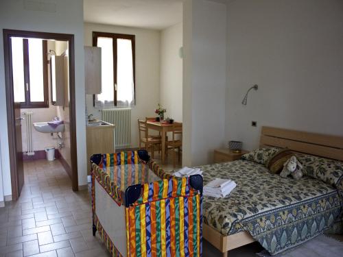 a living room with a couch and a bed in it at Rural Retreat in Sassoleone in Sassoleone