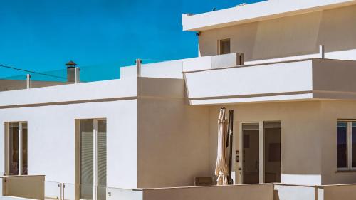 a white facade of a building at Dimora Cala Graziosa in Favignana