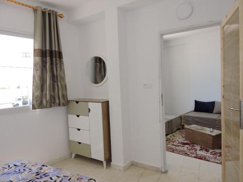 Postel nebo postele na pokoji v ubytování APPARTEMENT tout équipé à Médenine