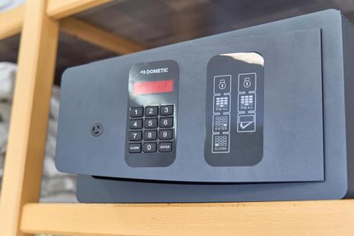 a remote control sitting on top of a shelf at Hotel Erika in Alexandroupoli
