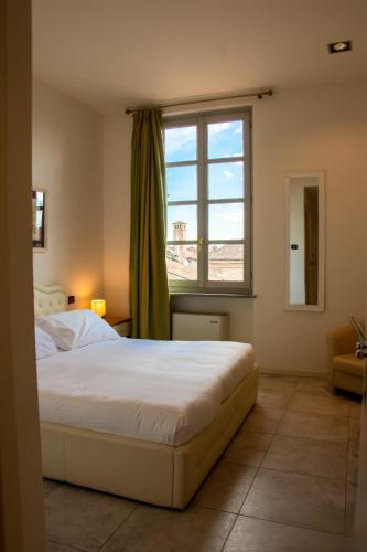 Postel nebo postele na pokoji v ubytování Hotel I Somaschi