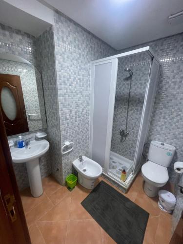 a bathroom with a shower and a toilet and a sink at Andalucia Cabo in Cabo Negro