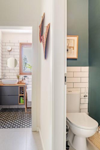 a bathroom with a toilet and a sink at Villa Hod 2BR Nature Suite in Ein Hod