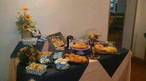 a table with a buffet of food on it at Hotel dei Pini in Lorica
