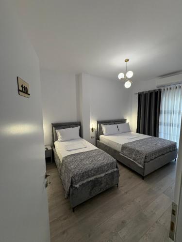Katil atau katil-katil dalam bilik di Salillari Guest house & Restaurant