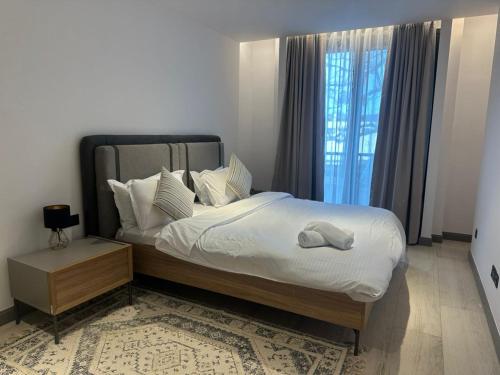 Ένα ή περισσότερα κρεβάτια σε δωμάτιο στο Diamond in the City