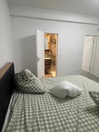 a bed with a pillow on it in a bedroom at Downtown Apartment in Bonn