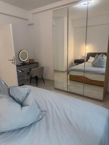 a bedroom with a bed and a mirror at Downtown Apartment in Bonn