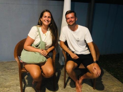 a man and a woman sitting in chairs at Kottamba Villa Tangalle in Tangalle