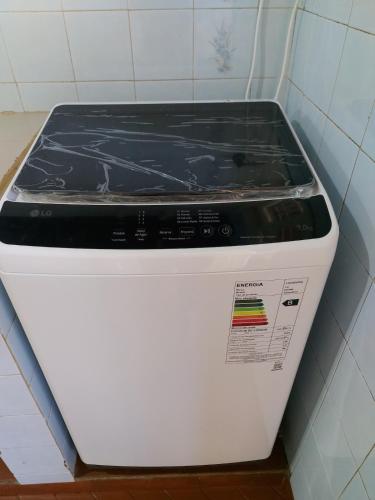a toaster oven sitting in a corner of a room at Encarnacion House in Encarnación