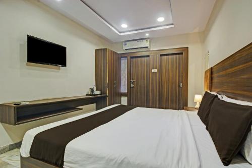 Katil atau katil-katil dalam bilik di Hotel O Srujana Stay Inn