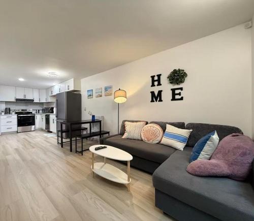 a living room with a couch and a table at Modern 3BR Townhouse near UW in Seattle