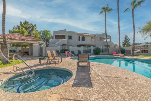 a swimming pool with chairs and a house at Tempe Room Private Bath Walk to ASU & Mill in Tempe