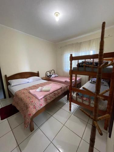 a bedroom with two bunk beds at Hostel e Pousada Vó Lili in Joinville
