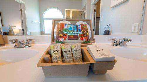 a bathroom with two sinks with books and a mirror at May 25' Reno ~Poker-Pool-Ping Pong-Shuffleboard in San Antonio