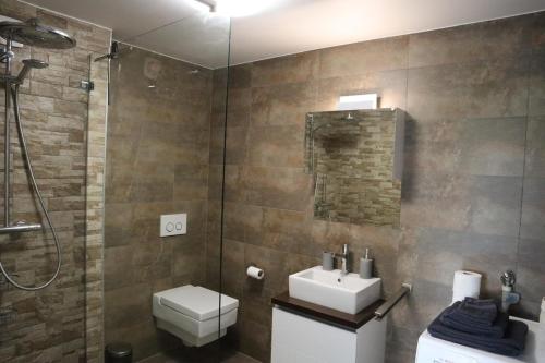 Ένα μπάνιο στο Appartement 2,5 pièces et SPA